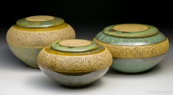 Church-keyed stoneware urns
